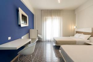 Postel nebo postele na pokoji v ubytování Saracen Sands Hotel & Congress Centre - Palermo