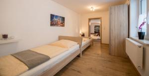 En eller flere senge i et værelse på Ferienwohnungen Schmid