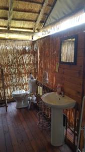 a bathroom with a toilet and a sink at Mwandi View in Kavimba