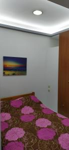 Postel nebo postele na pokoji v ubytování SeaSide Apartment Rio