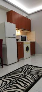 Kuchyň nebo kuchyňský kout v ubytování SeaSide Apartment Rio
