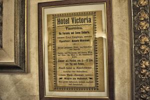 a framed picture of a menu on a wall at Hotel Victoria in Taormina
