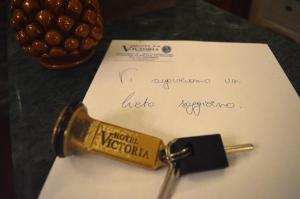 a pair of keys sitting on top of a piece of paper at Hotel Victoria in Taormina