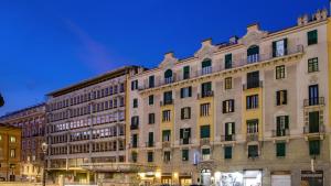 a large building in a city at night at Viminale View Hotel in Rome