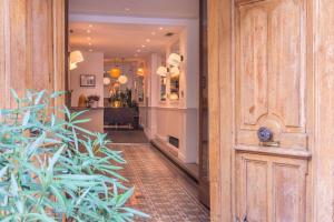 an open door to a hallway with a house at Hotel 29 Lepic in Paris