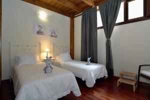 Postel nebo postele na pokoji v ubytování Villa Nelida peace lovers Vegueta By PVL + 35 fotografií