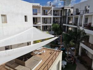 an aerial view of a building with awnings and a patio at Resort Il Mulino in Favignana