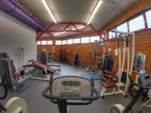 a gym with several treadmills and tread machines at Sporthotel Kapfenberg in Kapfenberg