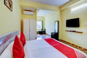 Postel nebo postele na pokoji v ubytování Gaurika Residency Boarding & Lodging - Padubidri