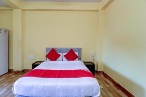 Postel nebo postele na pokoji v ubytování Gaurika Residency Boarding & Lodging - Padubidri