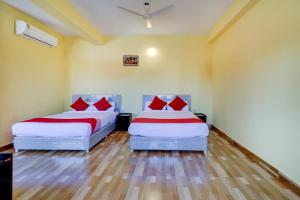 Postel nebo postele na pokoji v ubytování Gaurika Residency Boarding & Lodging - Padubidri