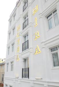 a white building with gold letters on it at Hira Hotel in Istanbul