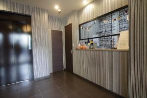 a hallway with a bar in a building at Tokyo Tourist Inn in Tokyo