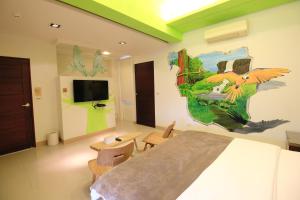 TV a/nebo společenská místnost v ubytování Green Park Homestay