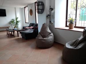 a living room with a couch and a table at Benarrabá Hostel in Benarrabá