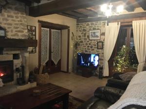 TV a/nebo společenská místnost v ubytování La Maison d'Olives