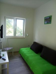 Televízia a/alebo spoločenská miestnosť v ubytovaní House Matusko
