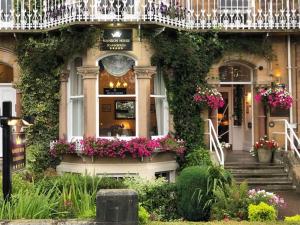 a building with flowers on the front of it at Mansion House in Scarborough