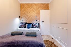 Posteľ alebo postele v izbe v ubytovaní Apartament 53 Długie Ogrody Gdańsk