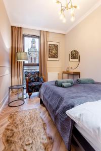 Posteľ alebo postele v izbe v ubytovaní Apartament 53 Długie Ogrody Gdańsk