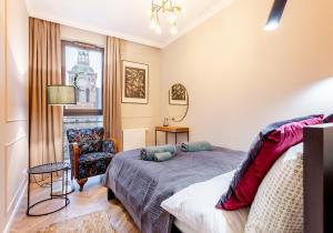 Posteľ alebo postele v izbe v ubytovaní Apartament 53 Długie Ogrody Gdańsk