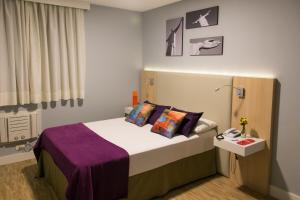 Postel nebo postele na pokoji v ubytování Rio Hotel by Bourbon Curitiba