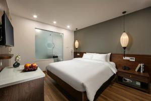 Televiisor ja/või meelelahutuskeskus majutusasutuses Hanoi Exclusive Hotel