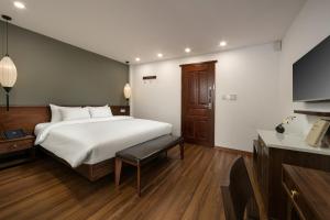 Voodi või voodid majutusasutuse Hanoi Exclusive Hotel toas