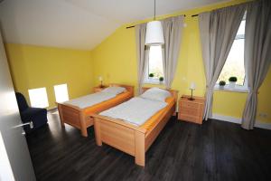 Ένα ή περισσότερα κρεβάτια σε δωμάτιο στο Landhaus Julia, 65331