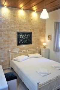 A bed or beds in a room at Traditional house in Corfu, kouramades vlg