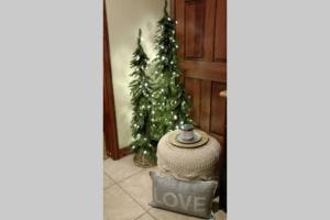 a christmas tree with a sign that says love at 4.5 Star!~Come to Paradise~Utah Alps~back door ski in Park City