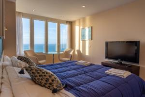 a hotel room with a large bed with a leopard on it at PACIFICO Family Home by Cadiz4Rentals in Cádiz