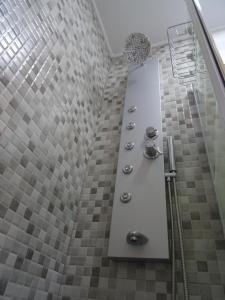 a bathroom with a shower with tiled walls at Estudio T34 - City Historic center in Lisbon +33 photos