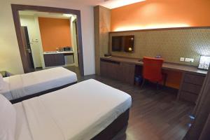 Postel nebo postele na pokoji v ubytování Jindagu Hotel Ipoh