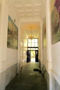 a hallway of a building with a chandelier at 36 Rooms Hostel Berlin Kreuzberg in Berlin