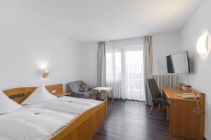 Postel nebo postele na pokoji v ubytování Hotel Bartholomäus