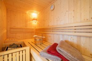 a sauna with two towels in a wooden cabin at Große Wies in Oberstdorf