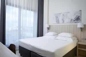 Rúm í herbergi á Tallink Spa & Conference Hotel