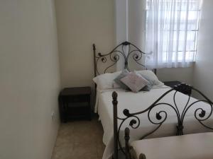 Ένα ή περισσότερα κρεβάτια σε δωμάτιο στο Tropical Villa