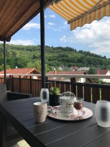 a table with a plate of food on a balcony at Sulzberg in Lahr