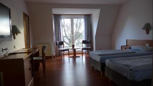 Postel nebo postele na pokoji v ubytování Hotel Heidpark