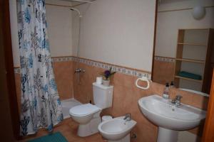 a bathroom with a toilet and a sink at Lanzarote Famara Beach in Famara +45 photos