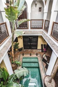an overhead view of a swimming pool in a building at Riad Aguaviva in Marrakech