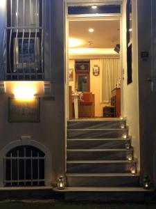 a staircase leading to a house with a fireplace at Hotel Antique in Istanbul