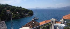 a view of a river with a boat in the water at Apartments Marin - amazing sea view in Splitska