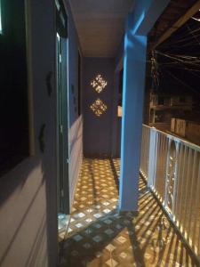 a hallway of a house with a blue wall at Casa Bela Paisagem in Mucugê