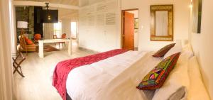 Rúm í herbergi á Cotinga Hotel Spa