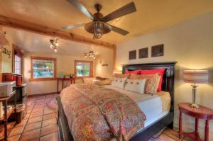 a bedroom with a bed and a ceiling fan at Cali Cochitta Vacation Rentals in Moab