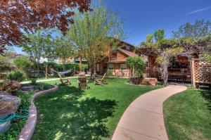 a house with a garden and a walkway at Cali Cochitta Vacation Rentals in Moab