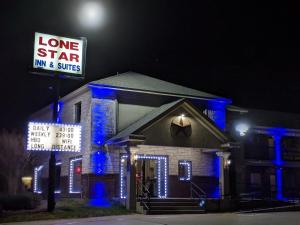 a home star inn and suites lit up at night at Lone Star Inn & Suites in Killeen